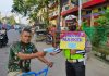 Satlantas Polres Kota Tanjungbalai Bagi – Bagi Masker Kepengguna Jalan