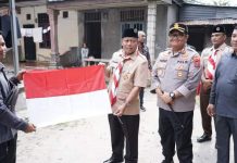 Sambut HUT RI ke – 77, Plt Wali Kota Tanjungbalai Beserta Forkopimda Bagikan Bendera Merah Putih Ke Warga